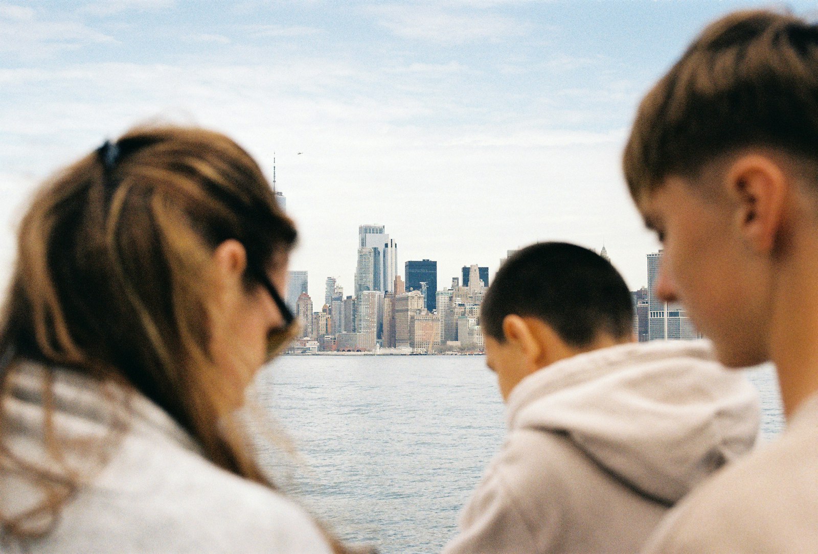 A family arriving in a new city, looking ahead together